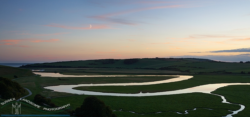 slides/Cuckmere Meanders and Moon.jpg cuckmere,meanders,panoramic,south,downs,nation,park,moon,east,sussex,coast,seven,sisters,country,park,water,sea,clouds,sky,coast,guard,cottages Cuckmere Meanders and Moon